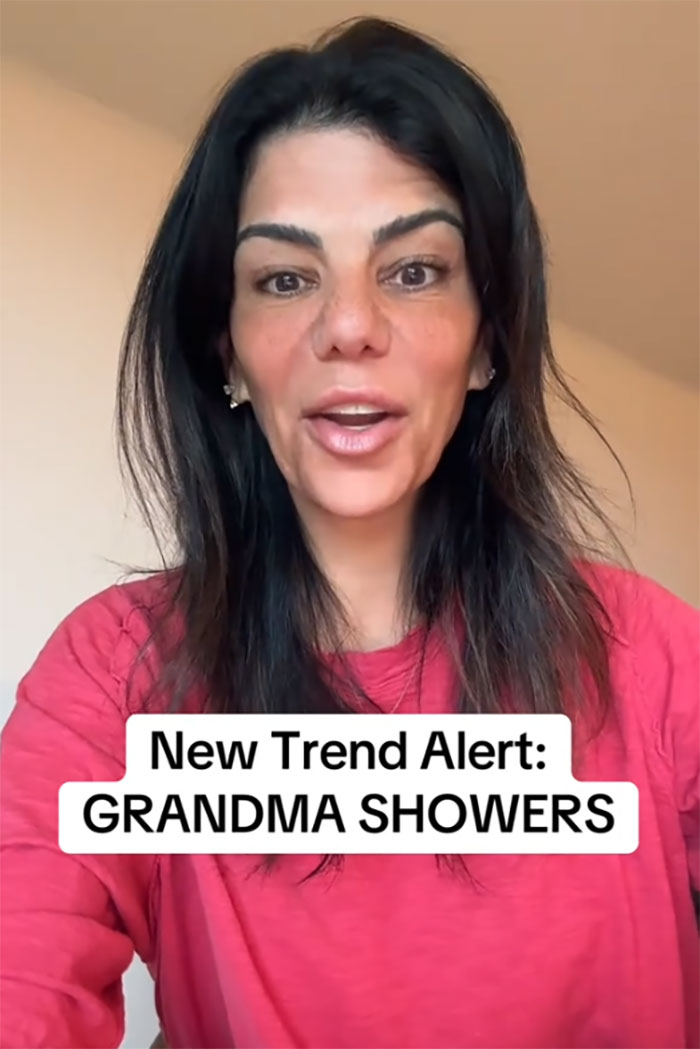 Woman in a red shirt discussing the new trend of grandmas having baby showers celebrating their new status Woman in a red shirt discussing the new trend of grandmas having baby showers celebrating their new status