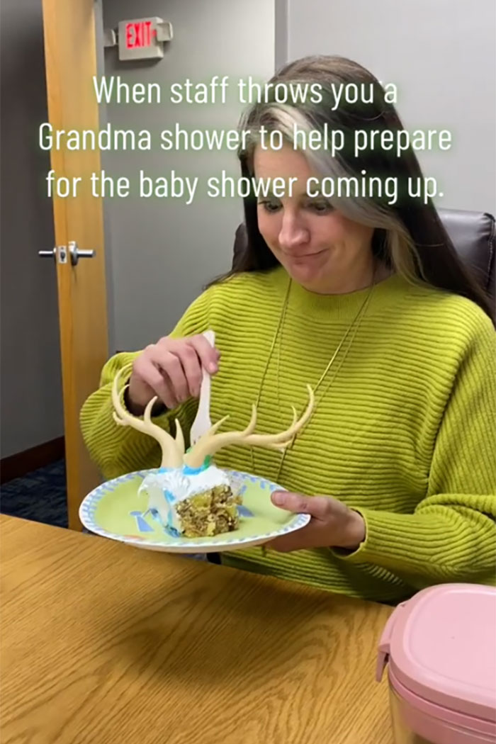 Woman in a green sweater at a grandma shower eating cake with antler decorations celebrating new grandma status. Woman in a green sweater at a grandma shower eating cake with antler decorations celebrating new grandma status.