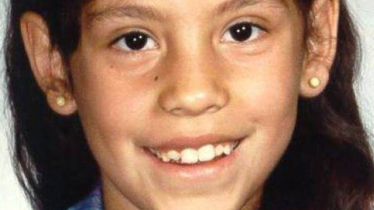 Close-up of a young girl smiling, related to chilling messages people left before going missing cases.