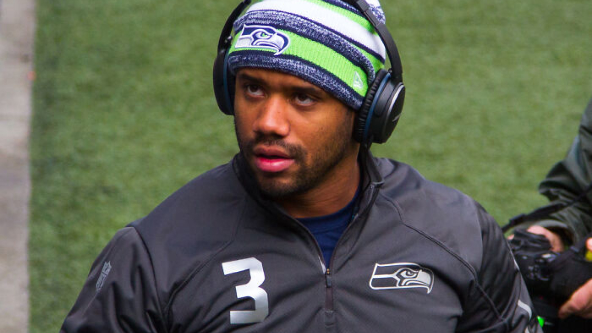Seattle Seahawks athlete wearing headphones and team gear, representing highest paid athletes in 2025.