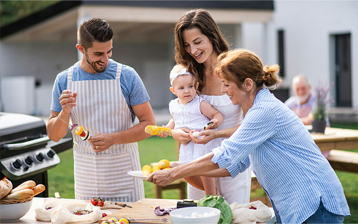 Family having a barbecue outdoors with a focus on woman dealing with life-threatening allergy and no-contact with MIL. Family having a barbecue outdoors with a focus on woman dealing with life-threatening allergy and no-contact with MIL.