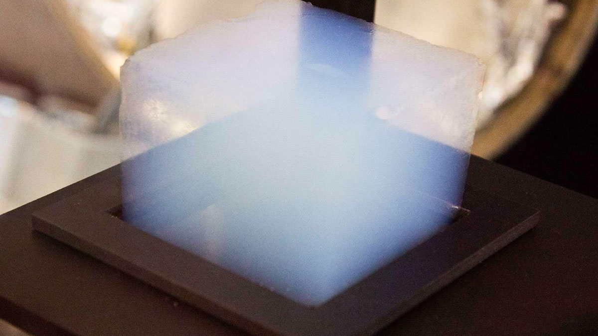 Translucent glowing cube on black base, one of the curious things people discovered without knowing what it was