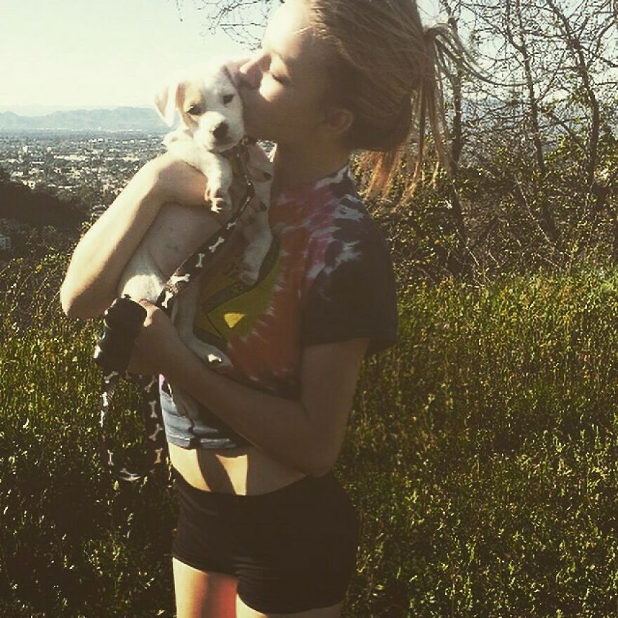 Sydney Sweeney outdoors holding and kissing a puppy, highlighting business ventures and net worth growth in 2025. Sydney Sweeney outdoors holding and kissing a puppy, highlighting business ventures and net worth growth in 2025.