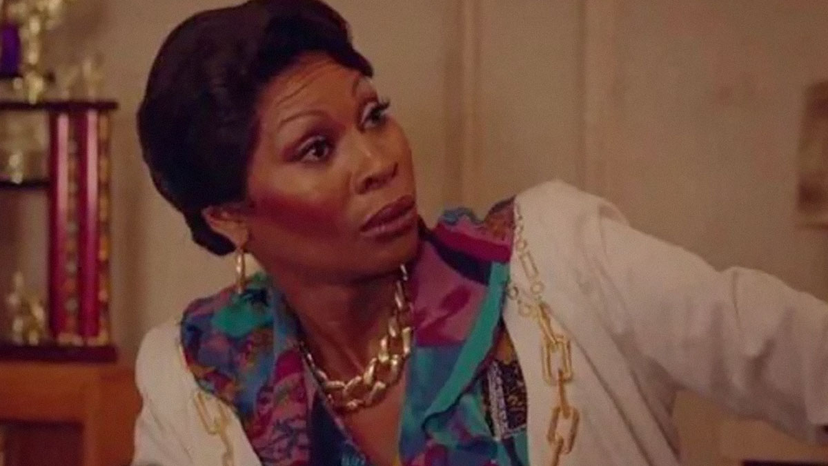 Woman with surprised expression wearing colorful blouse and white jacket in a scene inspired by true crime memes.