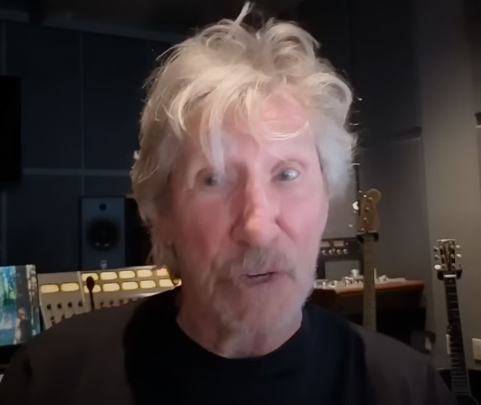 Roger Waters speaking in a studio setting with guitars in the background, discussing idiocy and nonsense.