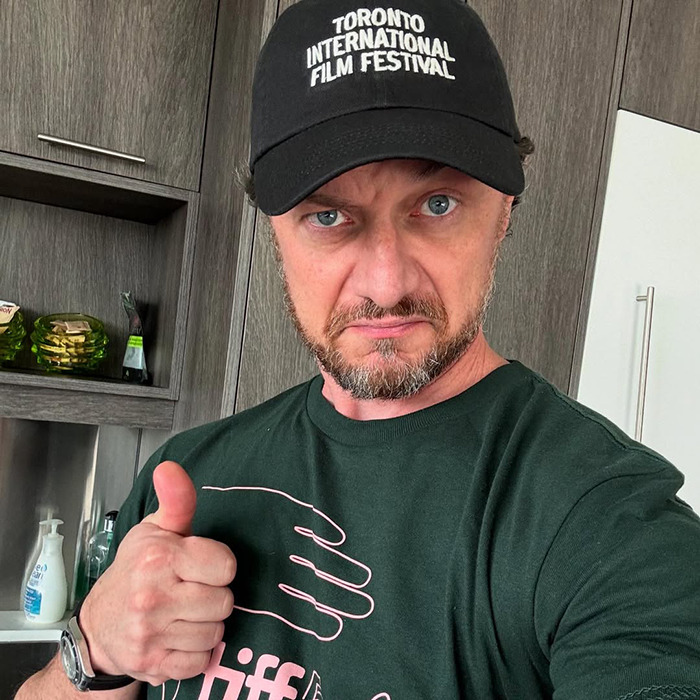 Man wearing Toronto International Film Festival cap and green shirt giving thumbs up, related to James McAvoy sucker punched news. Man wearing Toronto International Film Festival cap and green shirt giving thumbs up, related to James McAvoy sucker punched news.