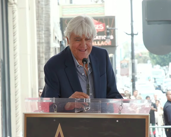 Jay Leno speaking at a podium outdoors, reacting to Jimmy Kimmel's suspension after offensive Charlie Kirk comments Jay Leno speaking at a podium outdoors, reacting to Jimmy Kimmel's suspension after offensive Charlie Kirk comments