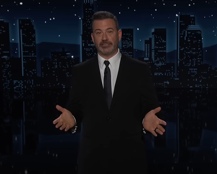 Jimmy Kimmel in a dark suit on a nighttime cityscape set, addressing the audience about suspension and controversy. Jimmy Kimmel in a dark suit on a nighttime cityscape set, addressing the audience about suspension and controversy.