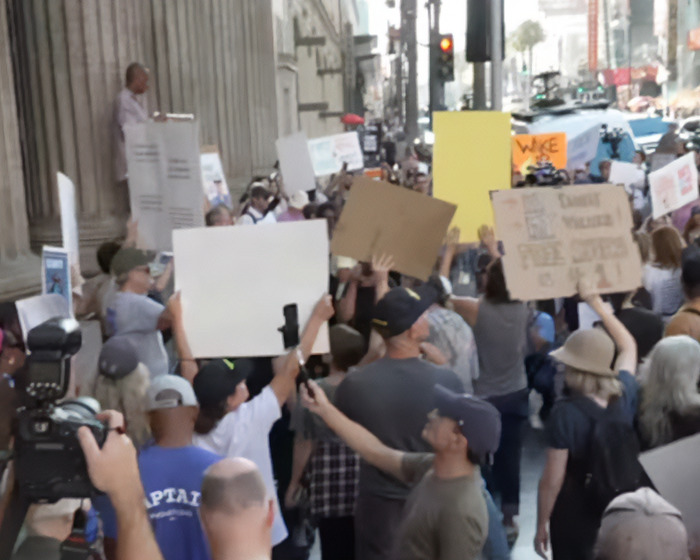 Crowd gathered on city street holding protest signs as Jay Leno reacts to Jimmy Kimmel suspension after offensive Charlie Kirk comments Crowd gathered on city street holding protest signs as Jay Leno reacts to Jimmy Kimmel suspension after offensive Charlie Kirk comments