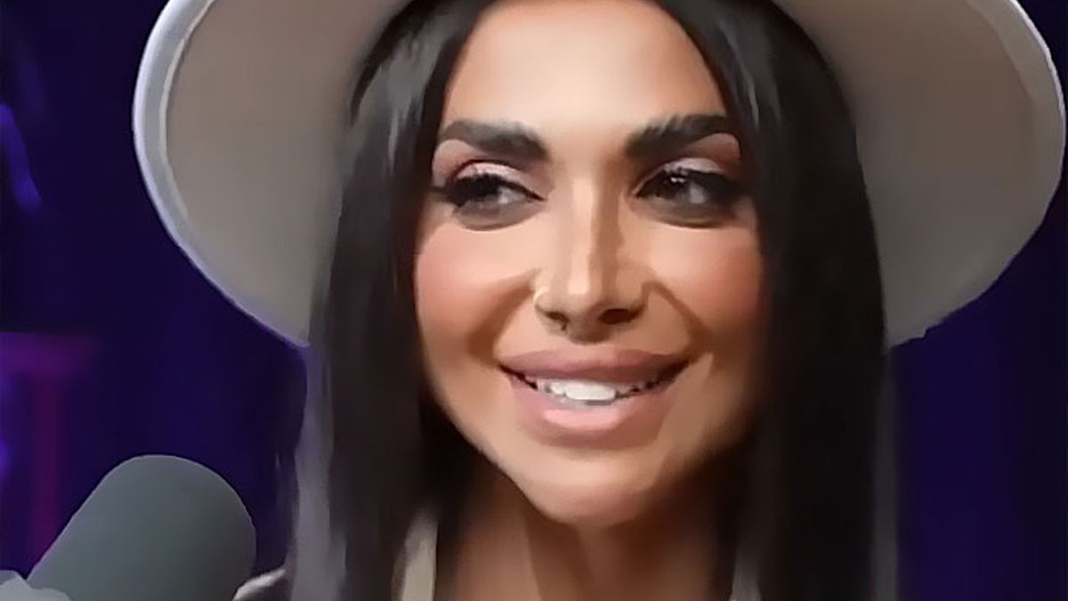 Influencer wearing a hat smiling during podcast recording while people meme job your love phrase online.