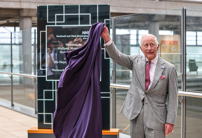 King Charles unveiling a plaque at Midland Metropolitan University Hospital, sharing emotional update on incurable cancer. King Charles unveiling a plaque at Midland Metropolitan University Hospital, sharing emotional update on incurable cancer.