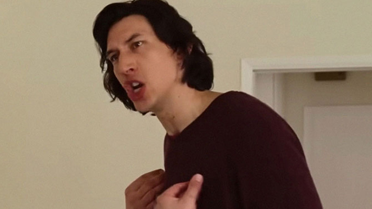 Man with dark hair in a maroon shirt speaking passionately indoors, a moment from stories about celebrities before fame.