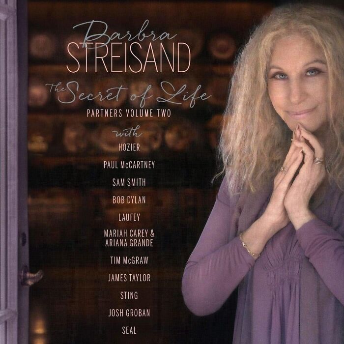Barbra Streisand album cover with artist list, featuring a soft focus portrait and warm brown background tones.