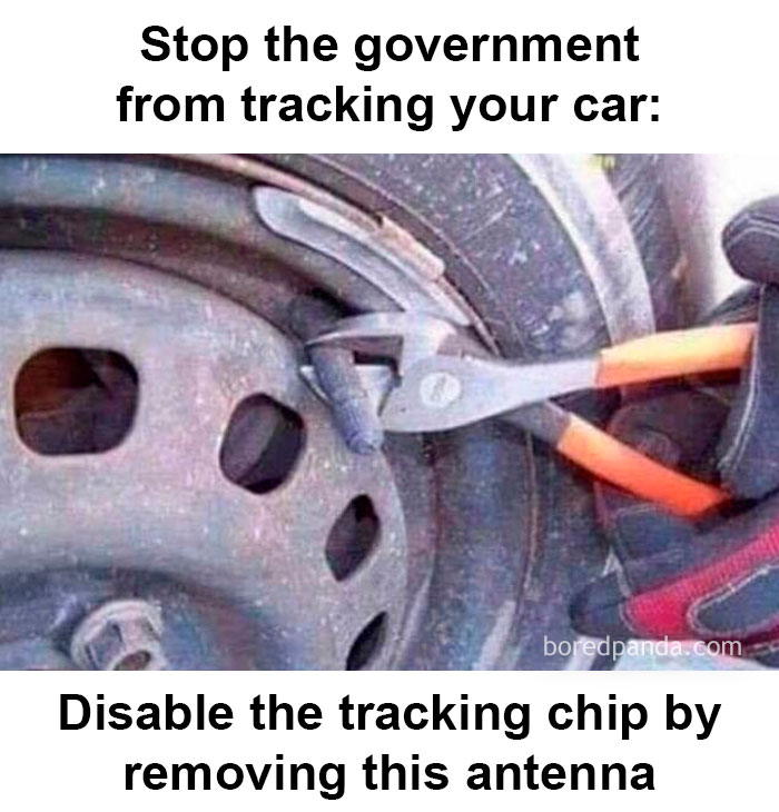 Car mechanics using pliers to disable a tracking chip antenna on a car wheel for vehicle repair and maintenance.