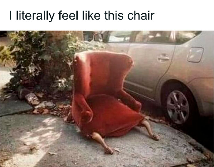 Old red chair on sidewalk with worn upholstery and detached legs, representing funny and weirdly comforting mental health memes.