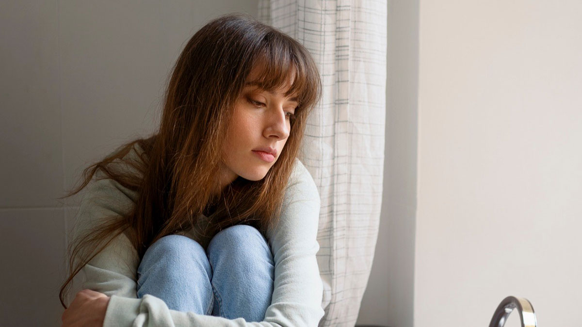 Teen daughter sitting alone in room looking upset after mom stole her underwear over hiding immoral things accusations