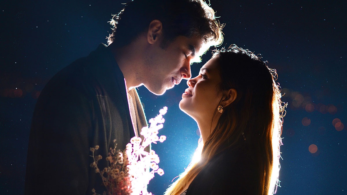 Couple close together at night with mysterious lighting symbolizing secretive boyfriend and a planned private investigator.