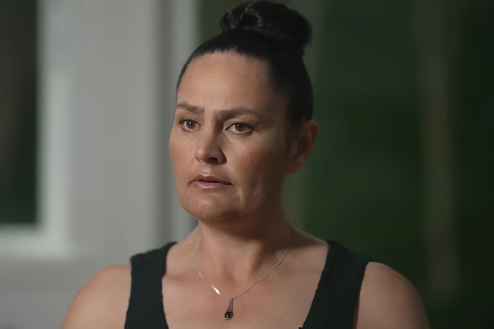 Mom of kids who vanished into wilderness speaking during an interview, wearing a black tank top and necklace. Mom of kids who vanished into wilderness speaking during an interview, wearing a black tank top and necklace.