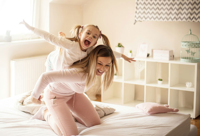 19YO forced to be a parent to little sister, showing frustration while caring and playing with her sibling at home. 19YO forced to be a parent to little sister, showing frustration while caring and playing with her sibling at home.