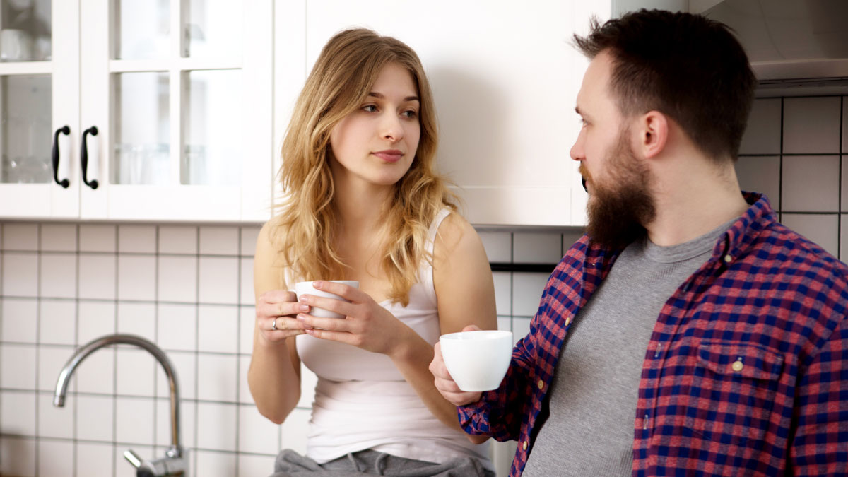 A young woman and man having an honest conversation over coffee, sharing things they would never admit in real life.