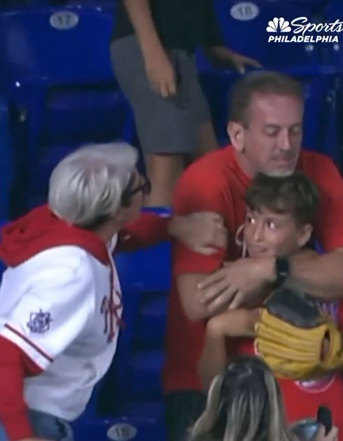 Woman known as Phillies Karen confronts man and young boy after snatching home run ball at baseball game. Woman known as Phillies Karen confronts man and young boy after snatching home run ball at baseball game.