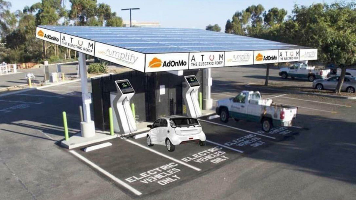 Electric vehicle charging station with misshaped cars and distorted proportions in a Photoshop fail example.