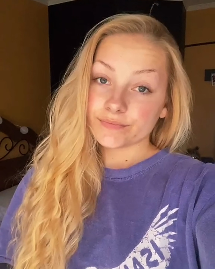 Young woman with long blonde hair wearing a purple shirt, related to Kentucky cheerleader baby experts' discussion. Young woman with long blonde hair wearing a purple shirt, related to Kentucky cheerleader baby experts' discussion.