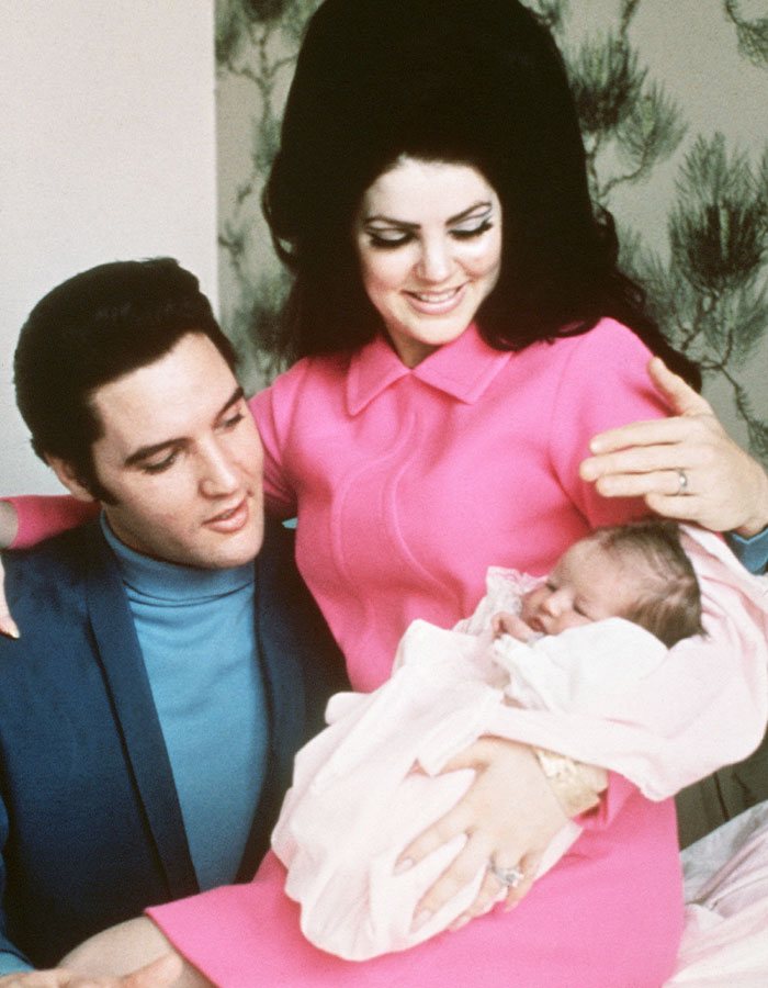 Elvis Presley and Priscilla holding baby, highlighting lawsuit revealing Lisa Marie Presley’s heartbreaking final moments. Elvis Presley and Priscilla holding baby, highlighting lawsuit revealing Lisa Marie Presley’s heartbreaking final moments.