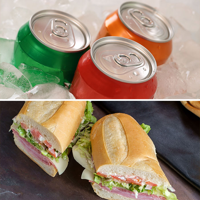 Soda cans chilling in ice above two deli sandwiches with lettuce, tomato, and cheese on a wooden surface related to dementia risk food. Soda cans chilling in ice above two deli sandwiches with lettuce, tomato, and cheese on a wooden surface related to dementia risk food.