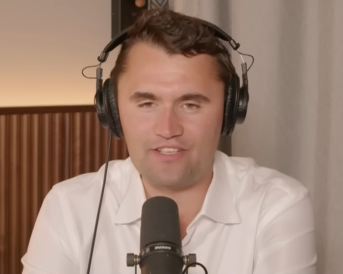 Man wearing headphones and white shirt speaking into a microphone during a podcast about South Park viewers enraged episode. Man wearing headphones and white shirt speaking into a microphone during a podcast about South Park viewers enraged episode.