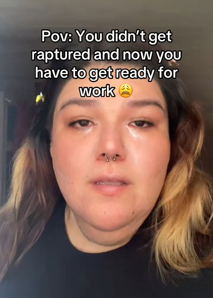 Person with tears in eyes and nose piercings reacting to RaptureTok viral prediction falling flat on social media. Person with tears in eyes and nose piercings reacting to RaptureTok viral prediction falling flat on social media.