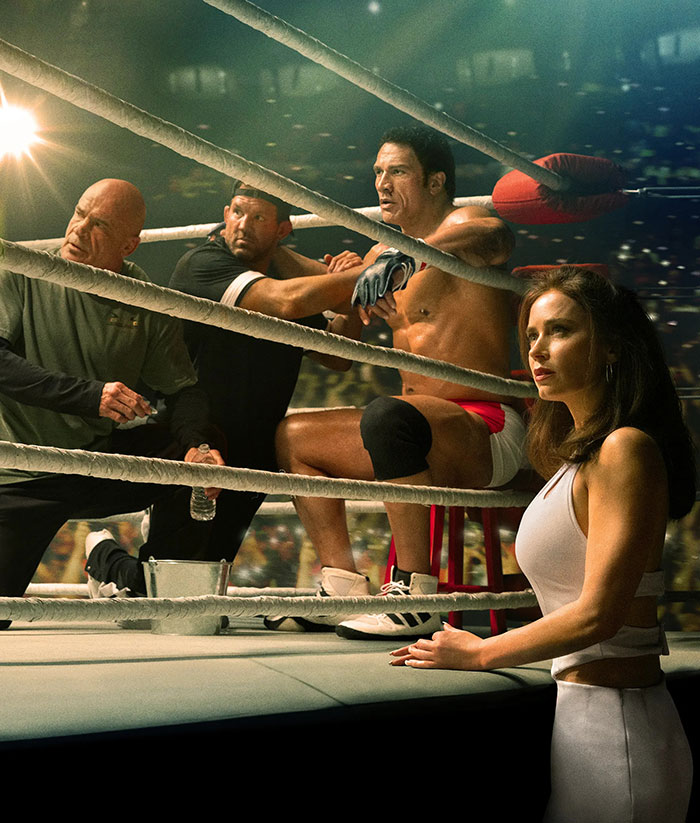 Dwayne Johnson in boxing ring corner with trainers and a woman nearby as fans defend actor’s slim look health concerns. Dwayne Johnson in boxing ring corner with trainers and a woman nearby as fans defend actor’s slim look health concerns.