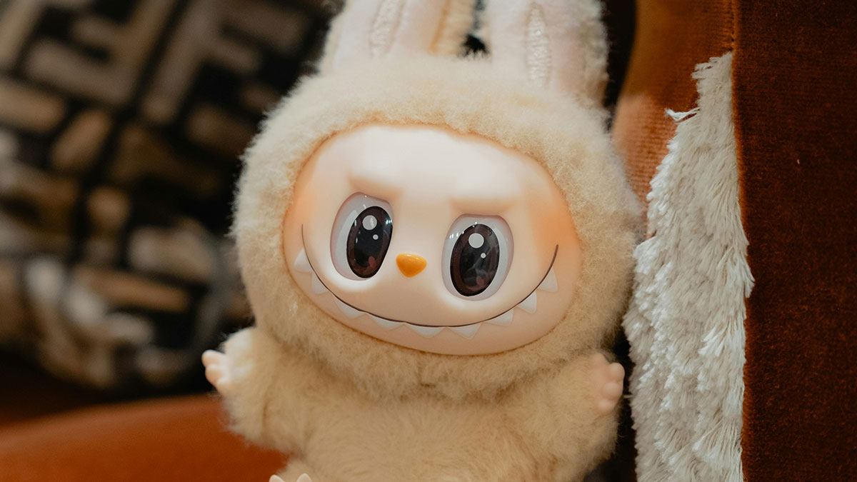 Plush toy with big eyes and sharp teeth, one of the overhyped products people say everyone should stop buying.