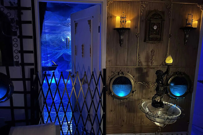 NYC apartment transformed into a detailed Titanic movie set with vintage decor and atmospheric blue lighting effects. NYC apartment transformed into a detailed Titanic movie set with vintage decor and atmospheric blue lighting effects.