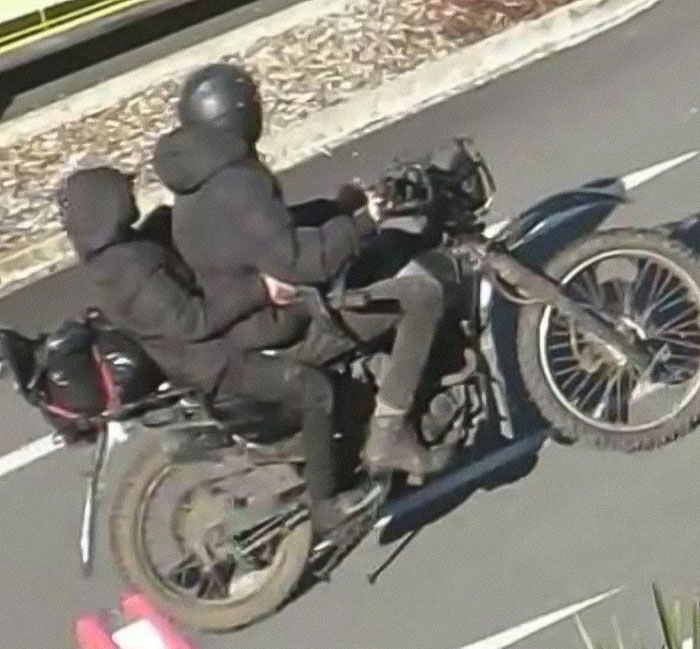 Two people in dark clothing riding a motorcycle related to mom of kids who vanished into wilderness case Two people in dark clothing riding a motorcycle related to mom of kids who vanished into wilderness case