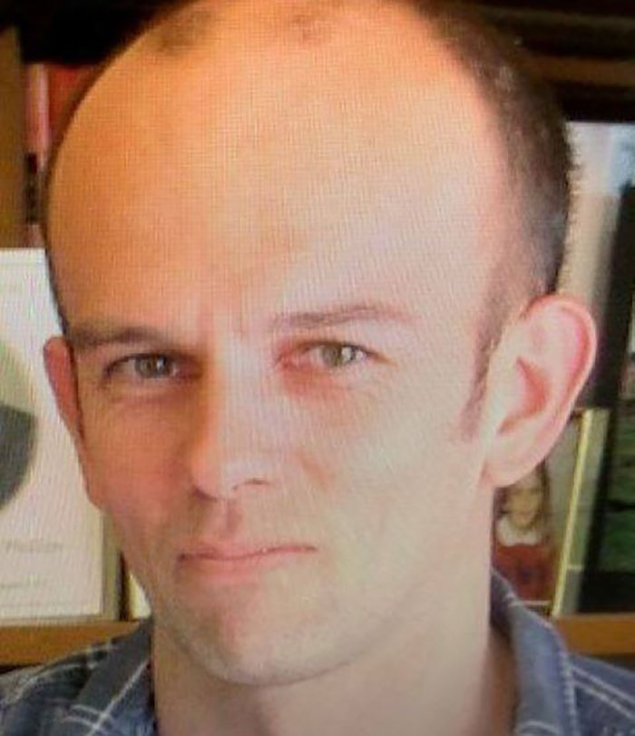 Close-up of a man with a serious expression linked to mom of kids who vanished into wilderness case. Close-up of a man with a serious expression linked to mom of kids who vanished into wilderness case.