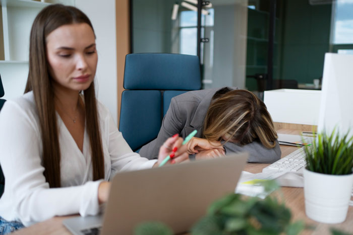 Stressed employee overwhelmed by toxic bosses in an office setting, highlighting workplace conflict and disciplinary challenges. Stressed employee overwhelmed by toxic bosses in an office setting, highlighting workplace conflict and disciplinary challenges.