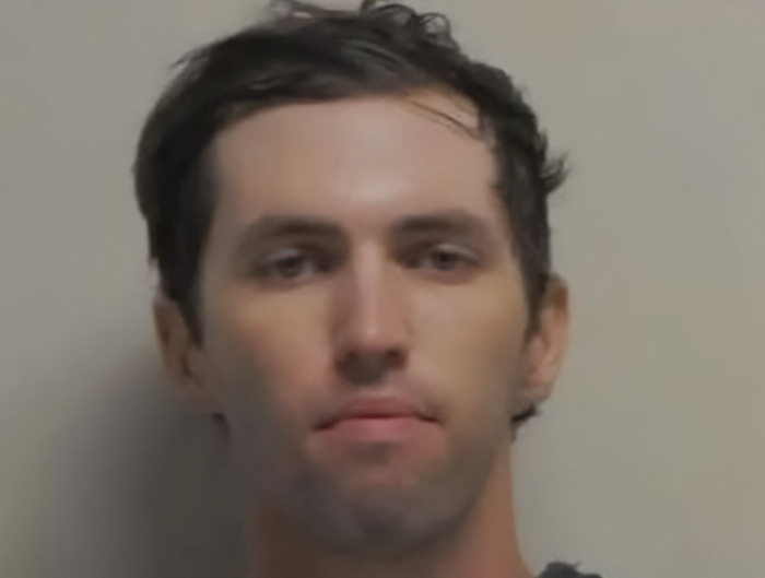 Tyler Robinson, suspect linked to Charlie Kirk case, appears in court with a neutral expression against a plain background. Tyler Robinson, suspect linked to Charlie Kirk case, appears in court with a neutral expression against a plain background.