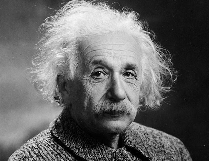 Black and white portrait of an older man with wild white hair, representing bizarre and fascinating historical events.