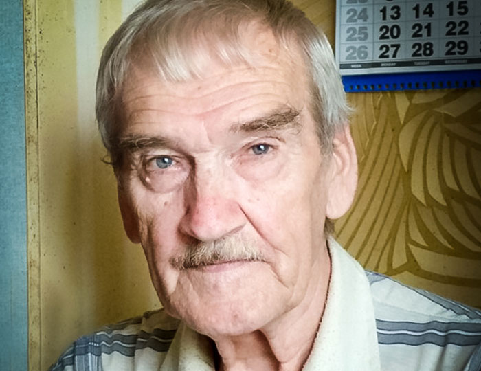 Portrait of an elderly man with gray hair and mustache, illustrating bizarre and fascinating historical events.
