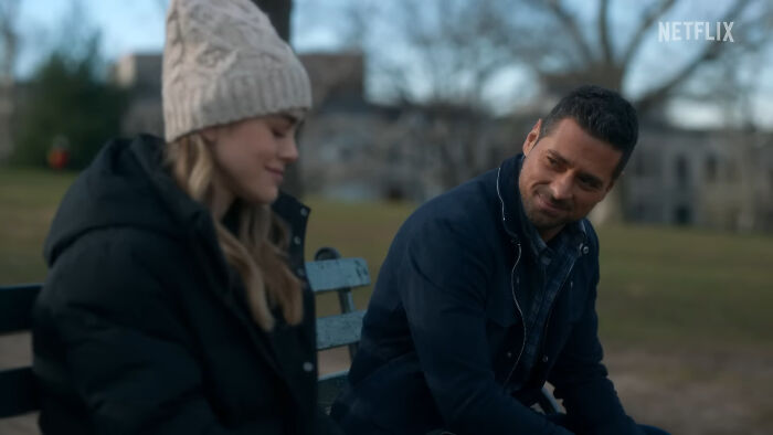 Two people sitting outside on a bench in cold weather reflecting on things people used to spend hours doing