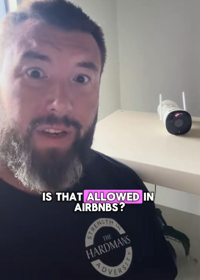 Man with beard in rental house reacting to disturbing discovery near security camera after family rushes out following discovery Man with beard in rental house reacting to disturbing discovery near security camera after family rushes out following discovery