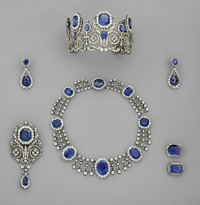 Set of vintage sapphire and diamond jewelry including a necklace, tiara, earrings, and brooch linked to jewel thief stories. Set of vintage sapphire and diamond jewelry including a necklace, tiara, earrings, and brooch linked to jewel thief stories.