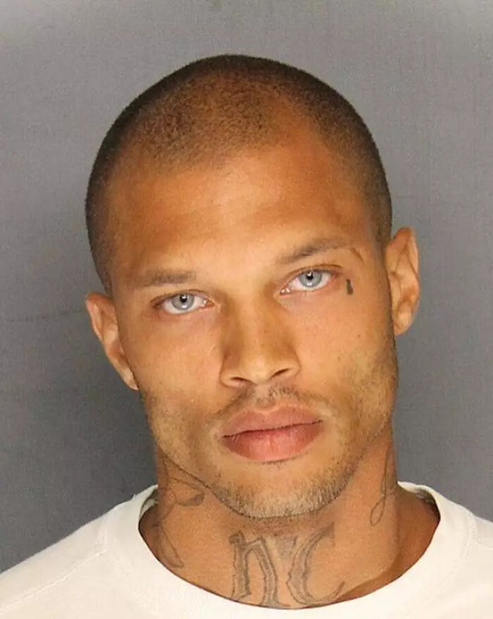 Close-up photo of the world's hottest felon showing tattoos and an intense expression at age 41. Close-up photo of the world's hottest felon showing tattoos and an intense expression at age 41.