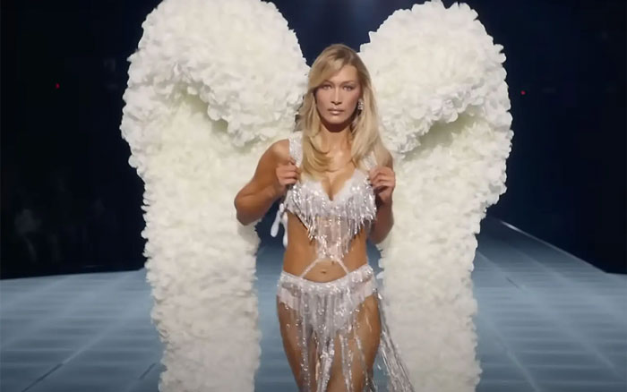 Bella Hadid walking runway wearing large Victoria’s Secret Angel wings during a fashion show event. Bella Hadid walking runway wearing large Victoria’s Secret Angel wings during a fashion show event.