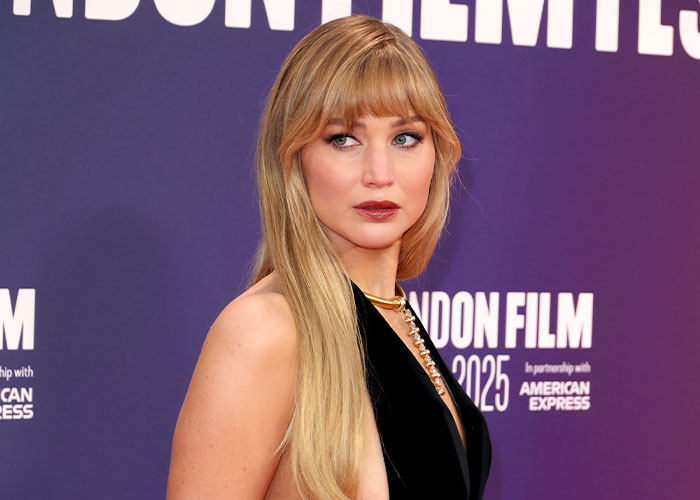 Jennifer Lawrence at a film event, posing in a black dress, addressing plastic surgery plans after viral video reaction. Jennifer Lawrence at a film event, posing in a black dress, addressing plastic surgery plans after viral video reaction.