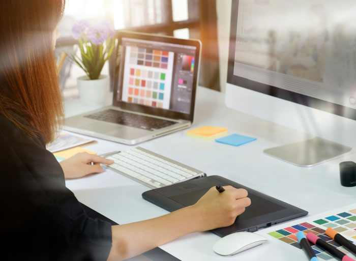 Person working at a computer with design software, illustrating company claims about market changes and salary raises. Person working at a computer with design software, illustrating company claims about market changes and salary raises.