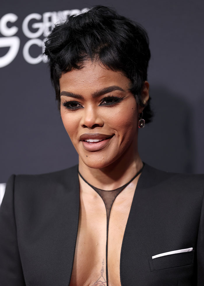 Teyana Taylor in a daring red carpet look featuring a revealing dress, sparking debate over the fashion trend. Teyana Taylor in a daring red carpet look featuring a revealing dress, sparking debate over the fashion trend.