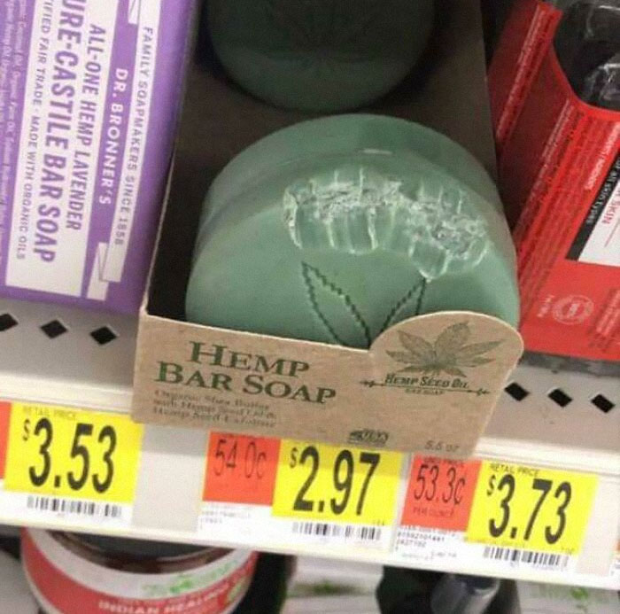 Hemp bar soap displayed on shelf with price tags in Walmart store aisle among various health products