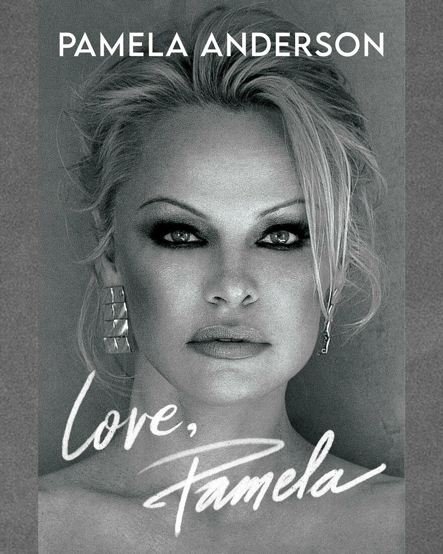 Black and white close-up portrait of Pamela Anderson with bold makeup and signature earrings highlighting her net worth status. Black and white close-up portrait of Pamela Anderson with bold makeup and signature earrings highlighting her net worth status.